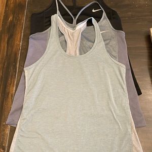 3 Nike / Under Amour Women’s Dri-Fit workout tanks .